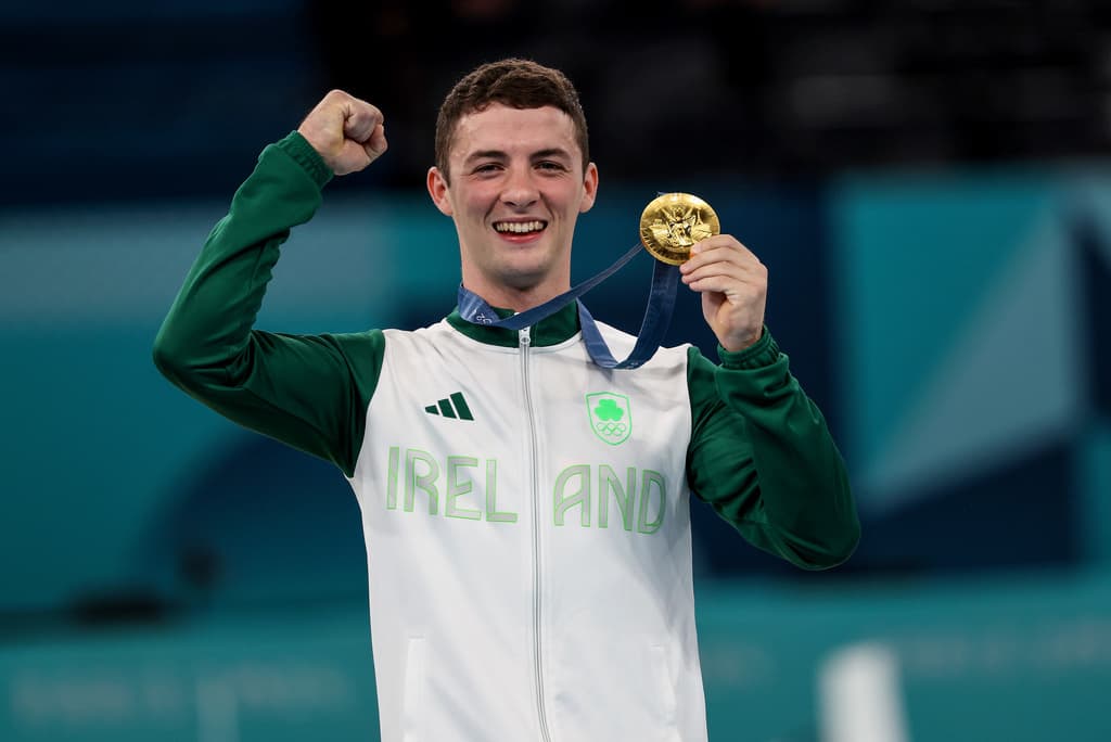 Rhys McClenaghan celebrating with his medal.